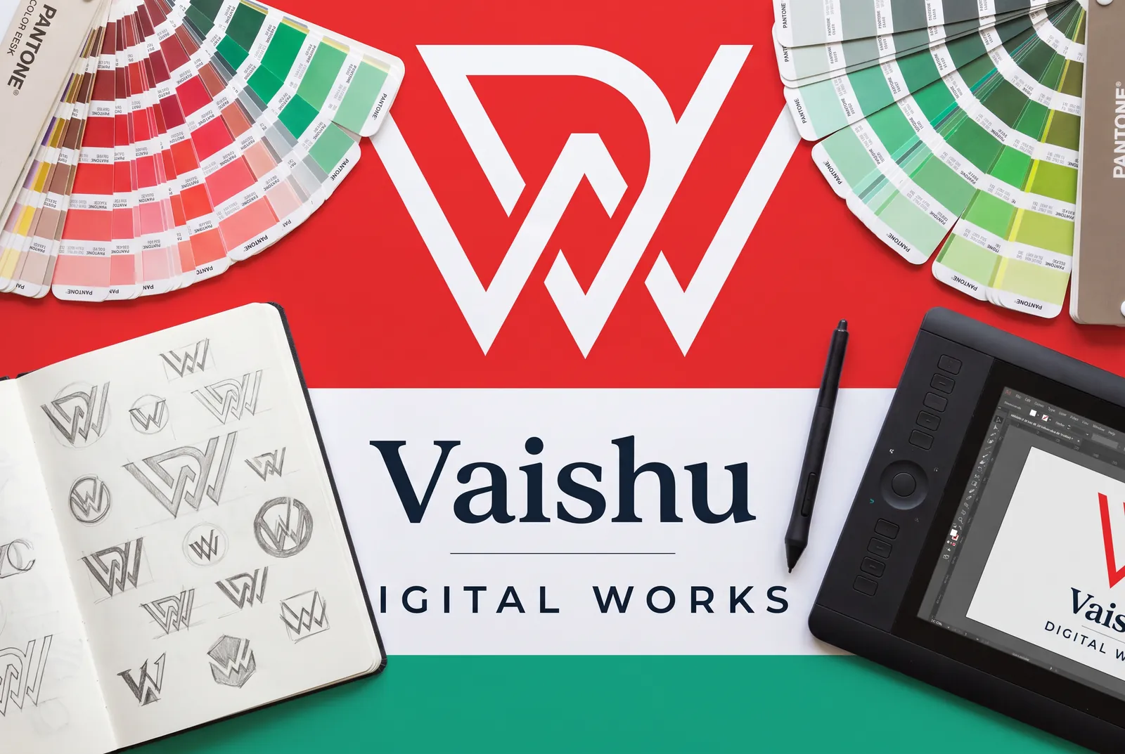 Designer's desk with Vaishu Digital Works logo sketches and colour swatches